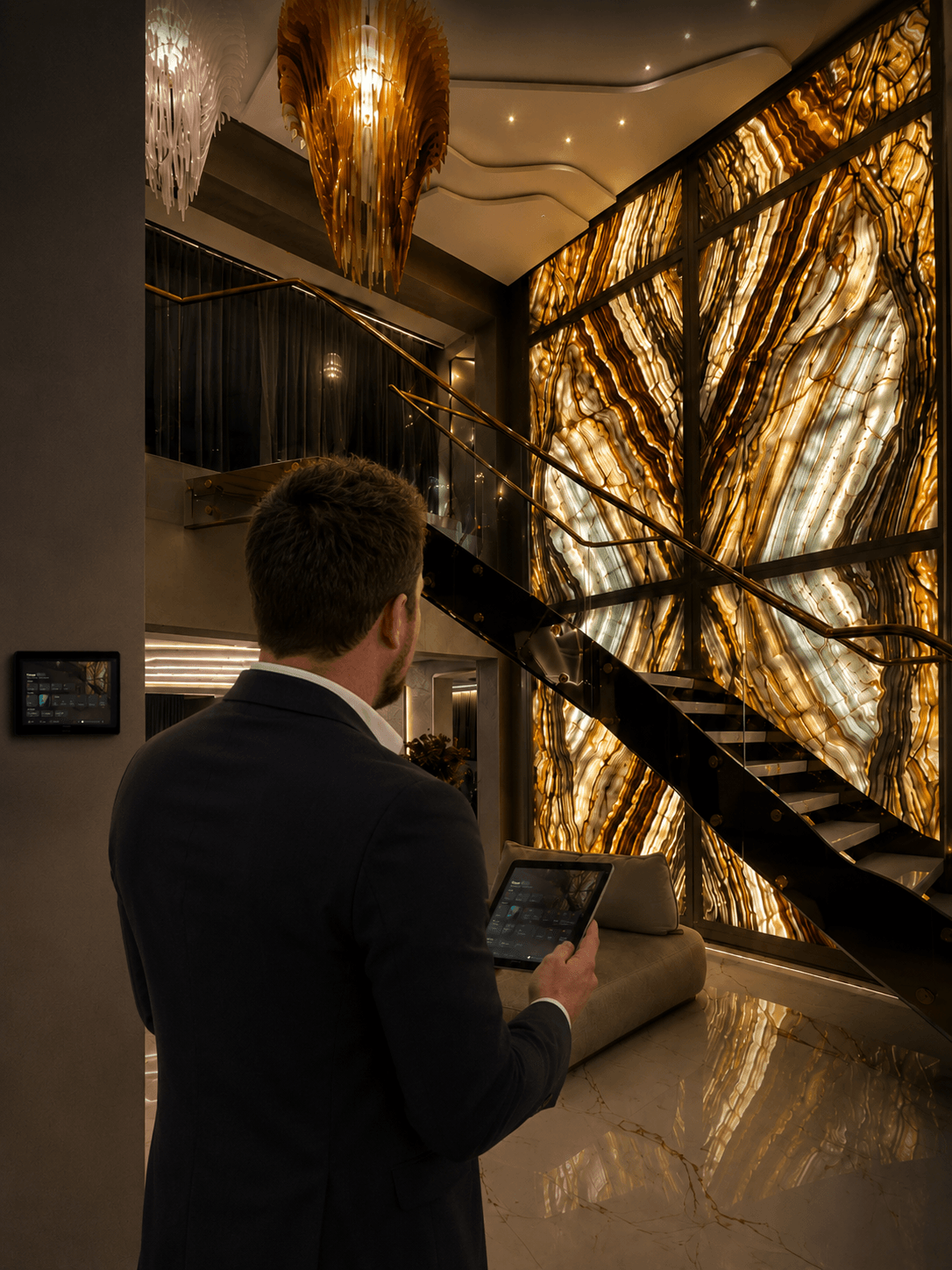 David Morel reviewing control details in a private luxury home interior