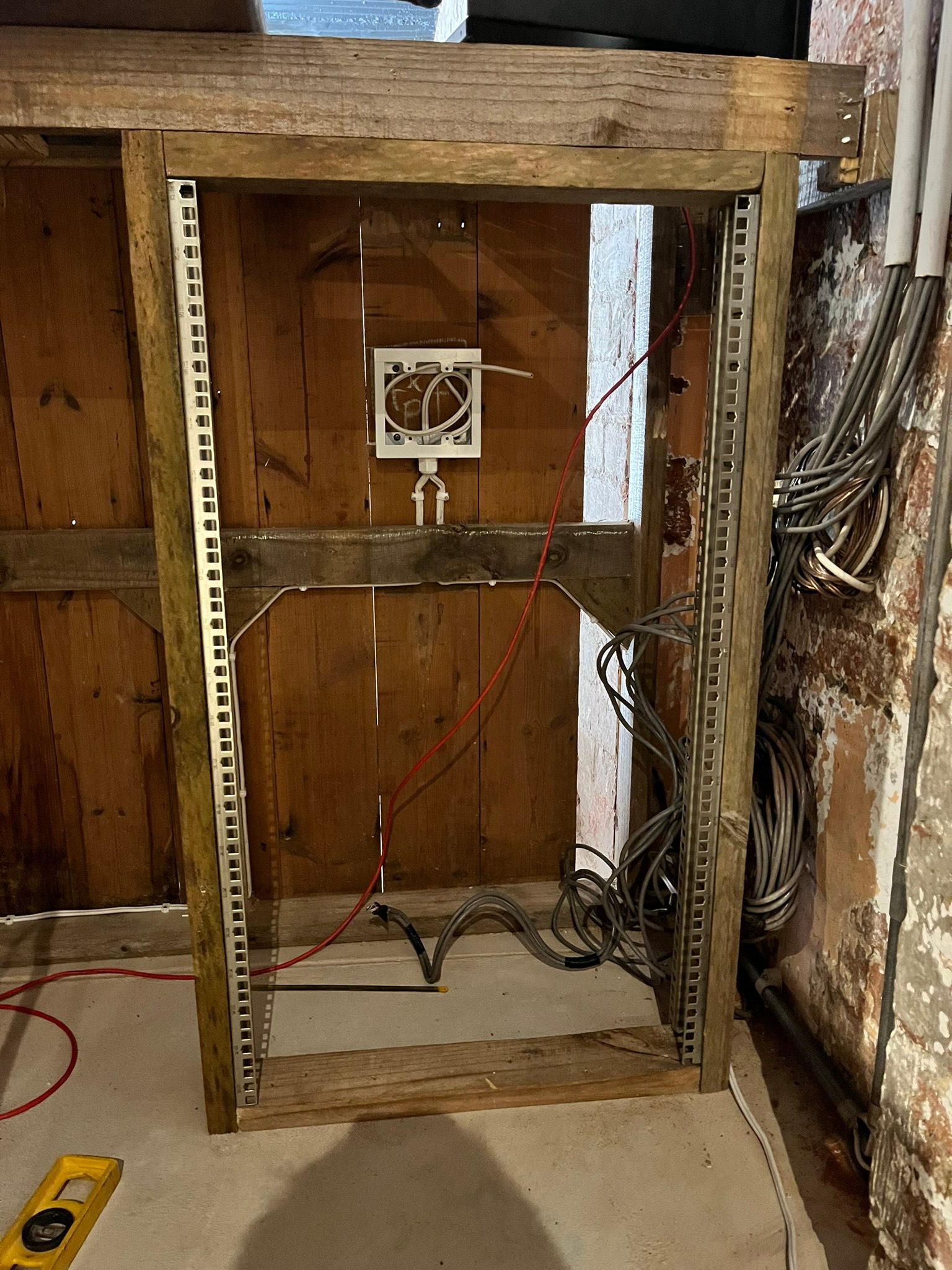 AV equipment rack built into a custom bar counter in the DG Technologies showroom