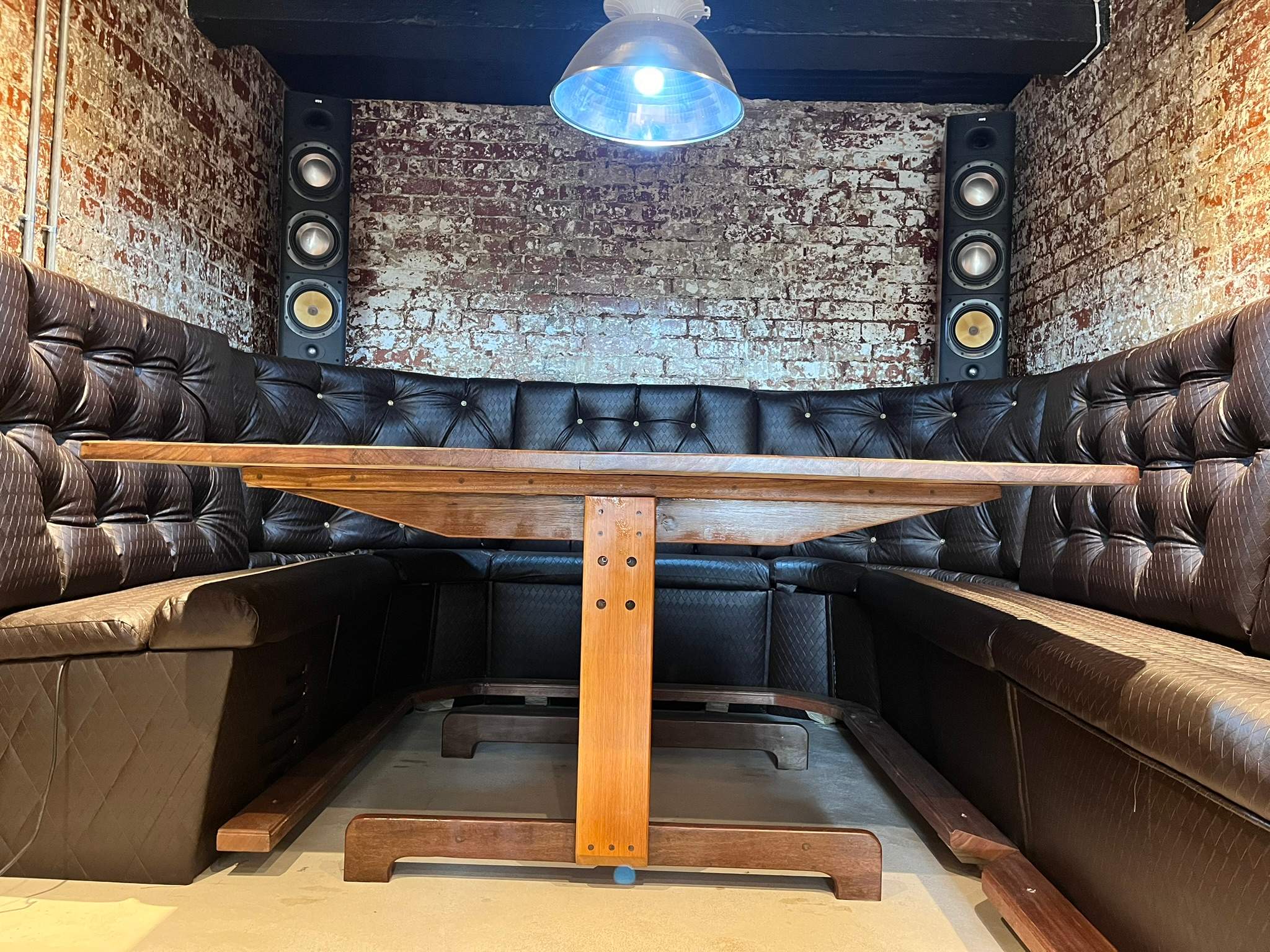 DG Technologies finished heritage entertainment room with custom seating and Crestron control