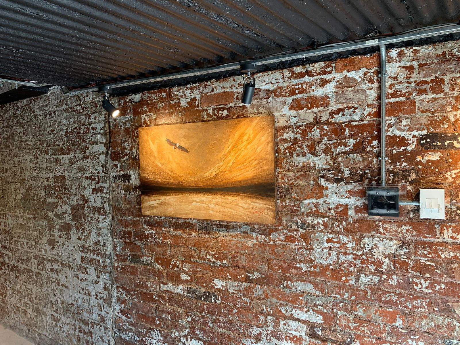 Invisible speaker hidden behind an artwork-style wall finish