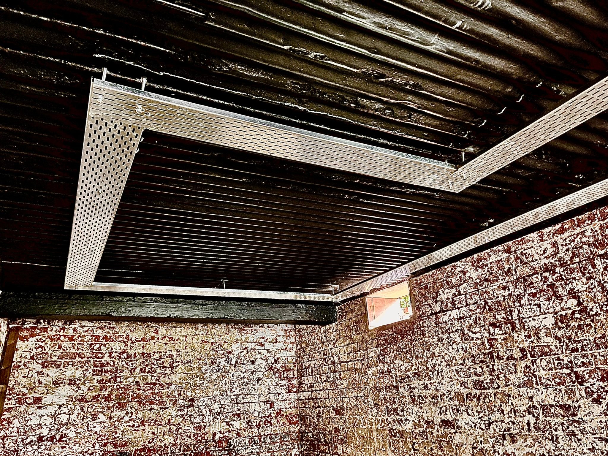 Surface mounted cable tray used to keep low-voltage cabling accessible and separated