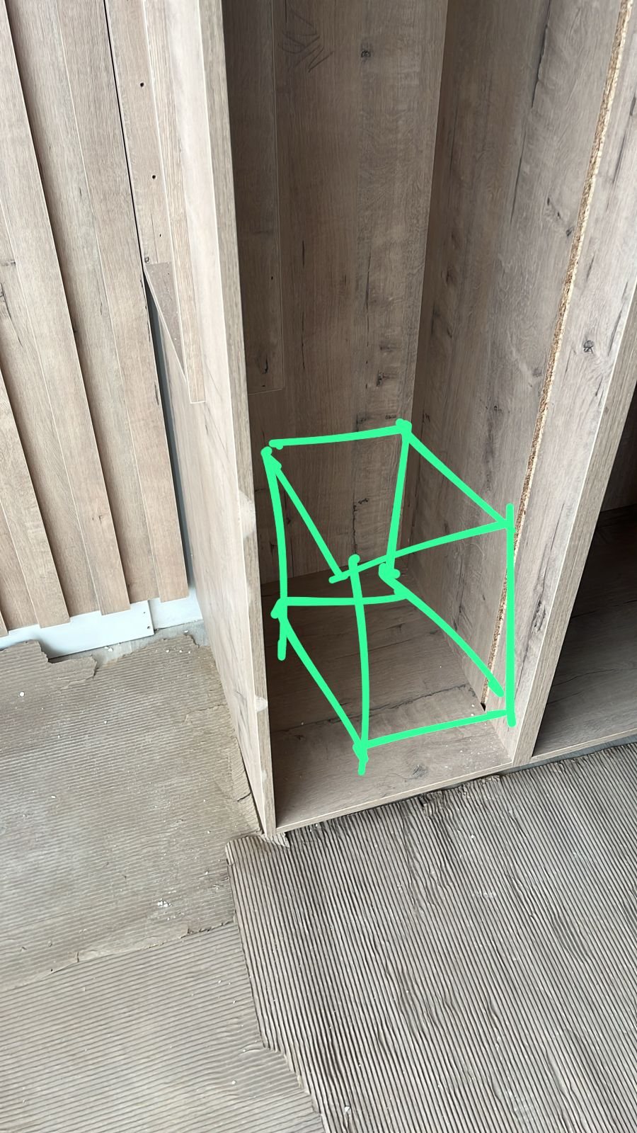 Subwoofer placement being considered inside joinery for a Sibaya estate home