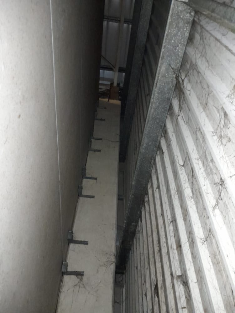 Tight service space accessed during commercial CCTV cabling work