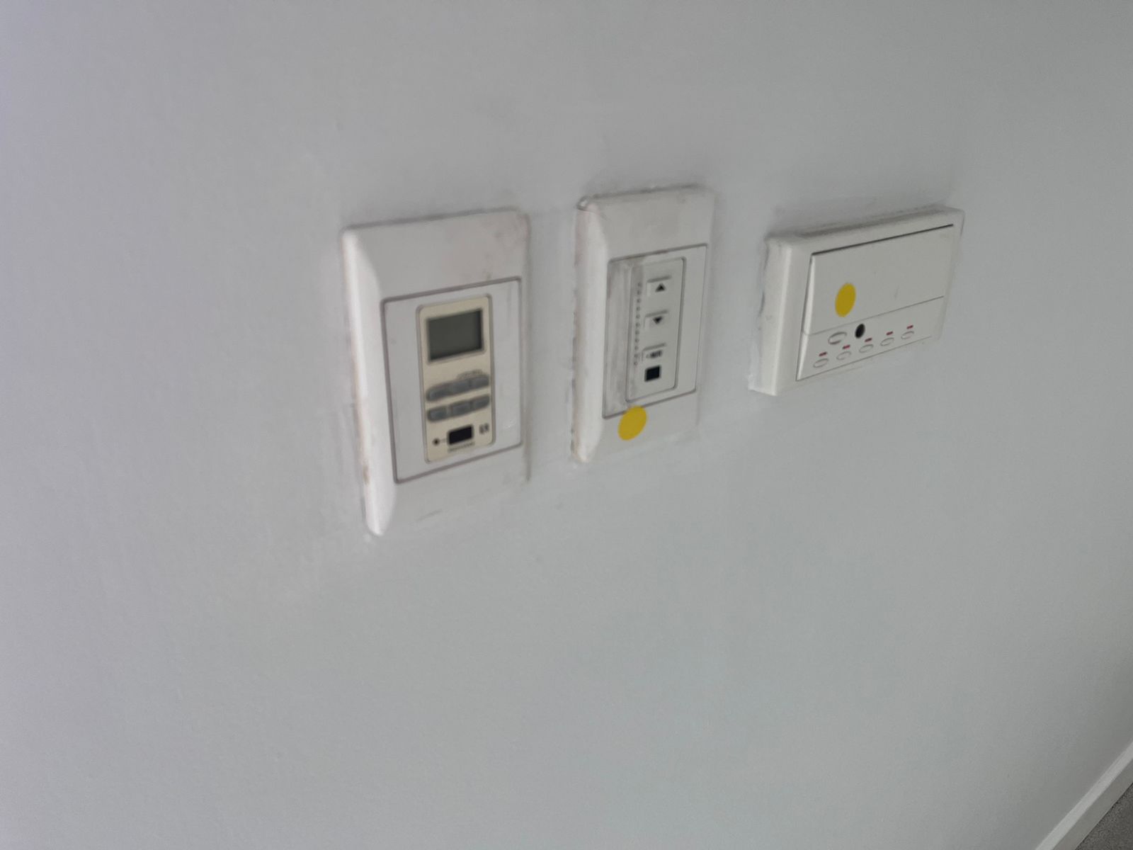 Old multiroom audio wall plates being removed during renovation